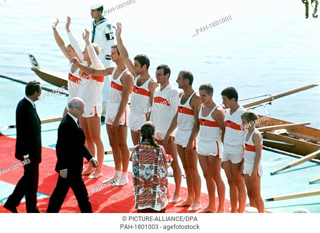 The German team of the rowing eight is happy about the gold medal at the victory ceremony during the Olympic Games on the 21st of October in 1968 in Mexico