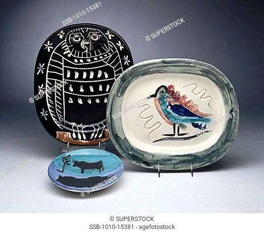 Plates with bird animal designs by Pablo Picasso, painted ceramic, 1881-1973