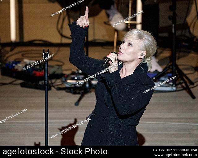 02 January 2022, Hamburg: Ina Müller, singer and music cabaret artist, is on stage at the Elbphilharmonie for her ""New Year's Concert""