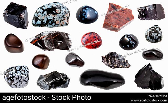 set of various Obsidian (volcanic glass) natural mineral gem stones and samples of rock isolated on white background