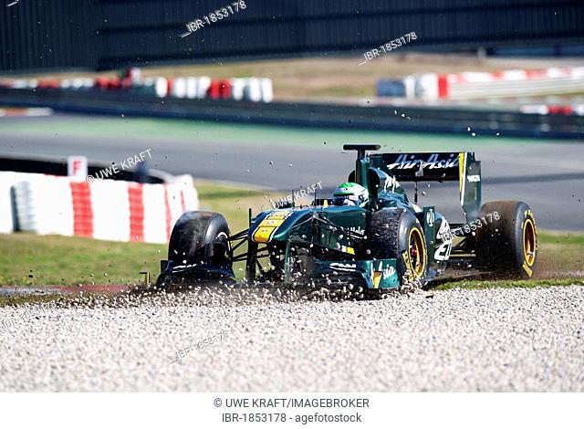 Heikki Kovalainen, Finland, with his Team Lotus-Cosworth T128 race car in the gravel, motor sports, Formula 1 testing on the Circuit de Catalunya race car in...