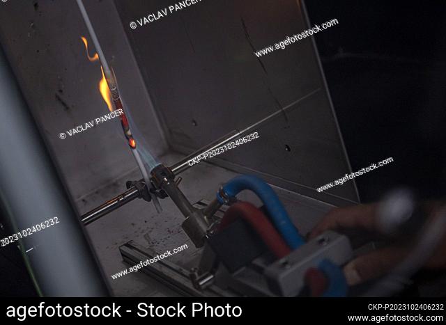 Cable flammability test in the materials testing laboratory of the Silon company, which produces plastic compounds, Plana nad Luznici, Czech Republic