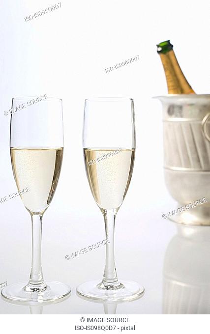 Bottle of champagne and flutes