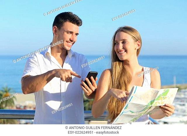 Couple discussing map or smartphone gps on vacations