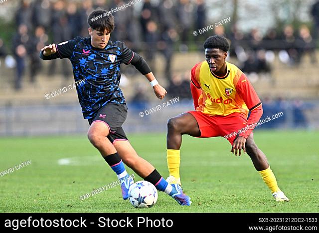 Jesus Acuna Miguez (16) of Sevilla fighting for the ball with Alpha Bah (14) of RC Lens during the Uefa Youth League matchday 6 game in group B in the 2023-2024...