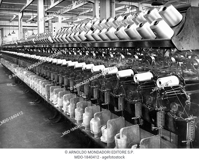 The spinning equipment of the SNIA Viscosa factory transforming the cellulose in rayon yarns. Cesano Maderno, 1920s