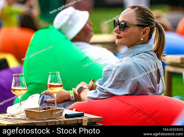 RUSSIA, YALTA - SEPTEMBER 16, 2023: People sit on bean bags during Winepark Fest, a wine harvest winemaking festival, in Vinny Park in the Black Sea resort of...