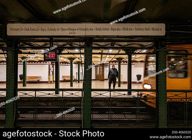 Budapest, Hungary A man stands on the platform of the Oktogon metro station