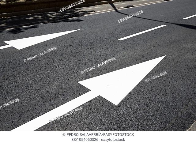 Two arrow directional signals on the floor