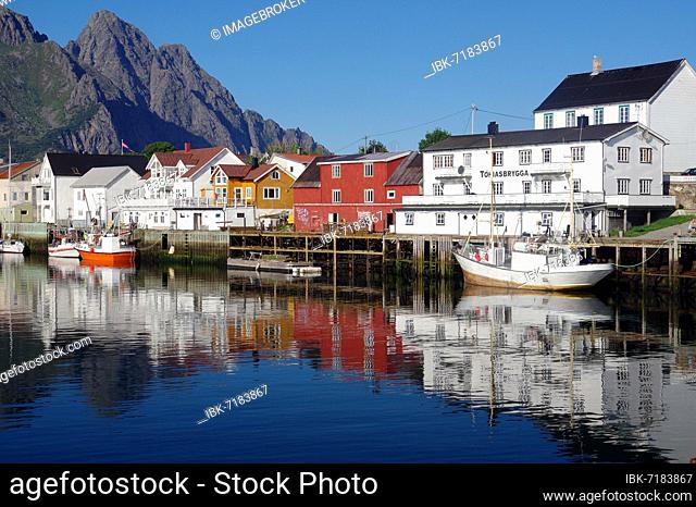 Fishing boats and houses reflected in the calm waters of a harbour, silence, tranquillity, Henningsvaer, Nordland, Lofoten, Norway, Europe