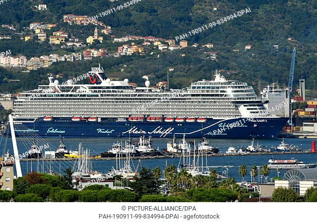 27 August 2019, Italy, La Spezia: The cruise ship "" My Ship 2 "" will leave the passenger terminal in the Molo Guiseppe Garibaldi port of the northern Italian...