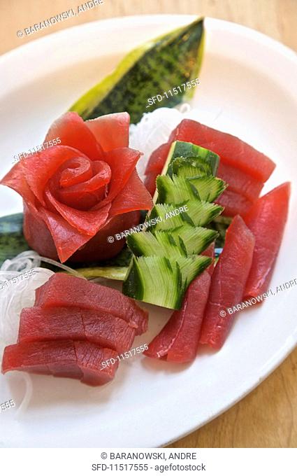 Tuna sashimi with artistically cut daikon radish and cucumber