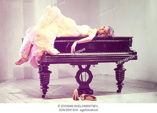 Portrait of woman with grand piano