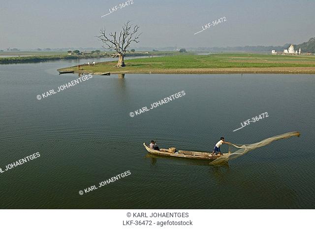 Throwing out a fishing net Taungthaman lake, Myanmar