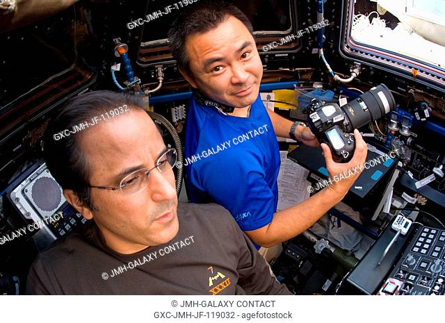 NASA astronaut Joe Acaba (foreground) and Japan Aerospace Exploration Agency astronaut Aki Hoshide, both Expedition 32 flight engineers