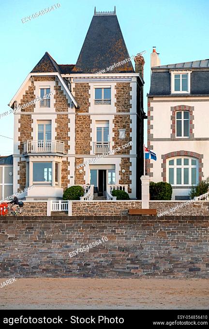 Saint-Malo, France - September 15, 2018: Front view of traditional granite houses along the promenade in Saint-Malo. Brittany, France