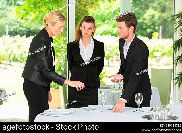 group of waiters and waitresses at work