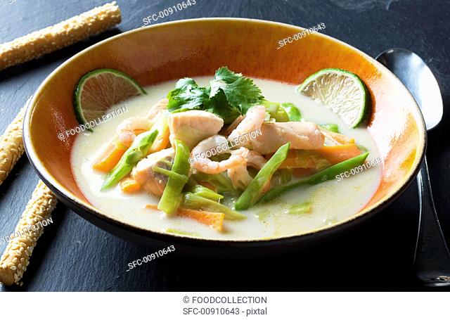 Coconut soup with salmon and prawns Thailand