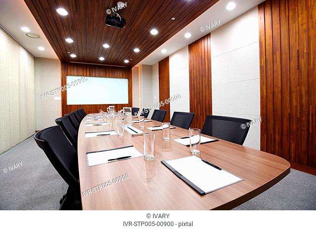 Conference Room With Long Table Set For Meetings