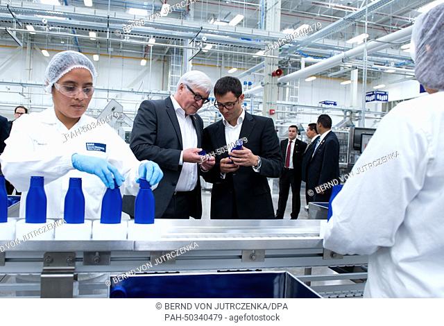 Factory manager of Beiersdorf AG Sebastian Gottschalk (R) guides German Foreign Minister Frank-Walter Steinmeier (SPD 2nd L) on a tour through the production...