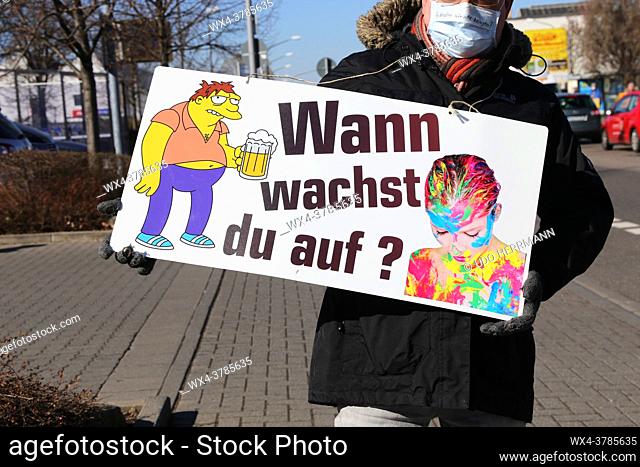 Rally against Corona measures, Germany: Demonstrators express their criticism of corona policies with an approved sign action in Industriestrasse in...