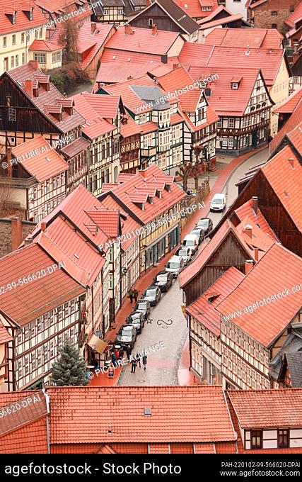 ILLUSTRATION - 02 January 2022, Saxony-Anhalt, Stolberg: View of the roofs of old half-timbered houses in the Harz village of Stolberg