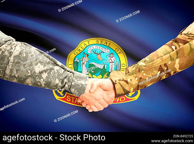 Soldiers handshake and US state flag - Idaho