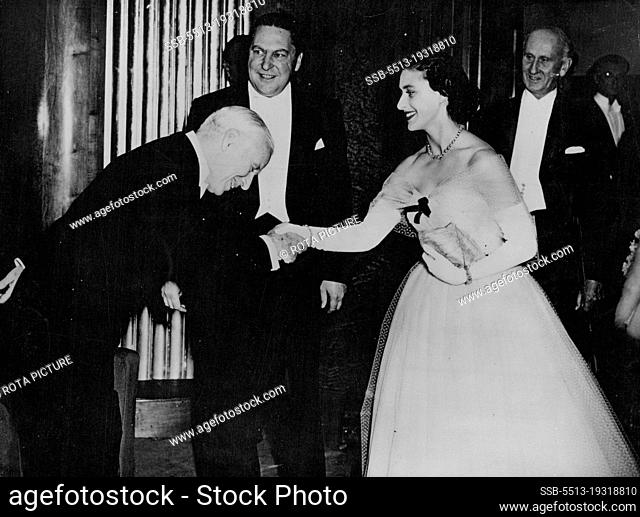 Charlie Welcomes Princess To Premier -- Charles Chaplin Deams as he bends over the hand of Princess Margaret as the Princess arrived at the Odeon theatre
