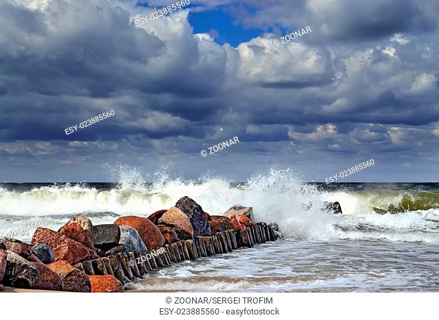 Stormy Baltic sea and breakwater