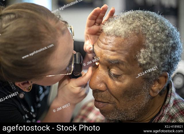 Detroit, Michigan - The OneSight Foundation organized a free clinic that offered eye exams and prescription glasses for low-income residents