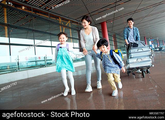 Happy family at the airport