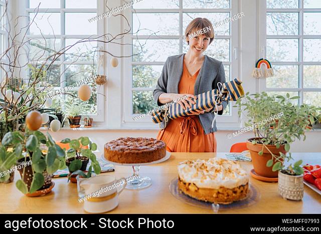 Woman holding gift during Easter at home