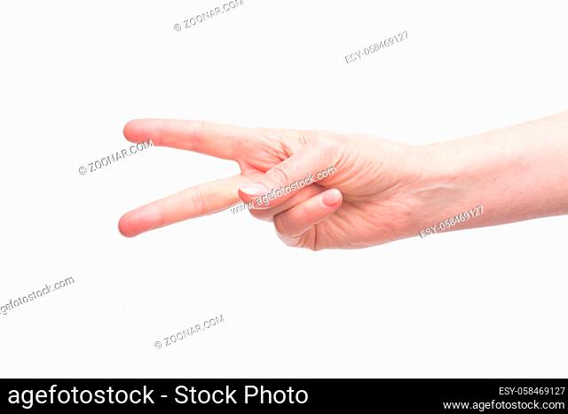 Close-up picture of woman#39;s hand demonstrating success, independance and happiness of any actions happenning in business life. Two fingers