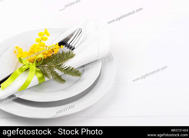 Spring table setting with mimosa easter holidays dinner
