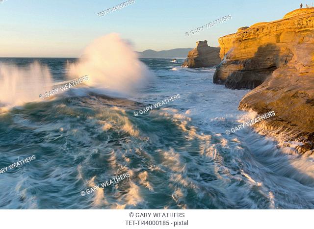 Waves crushing over cliffs