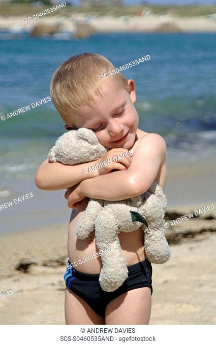 Young boy and teddy, Northern Spain, Mediterranean
