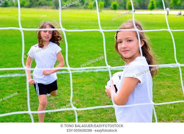 Soccer football kid girls playing on sports outdoor field
