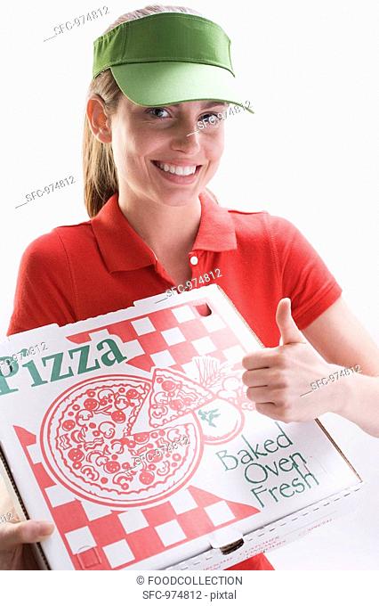 Smiling woman with pizza box, giving thumbs up sign