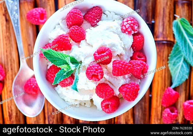 cottage with fresh raspberry in the bowl