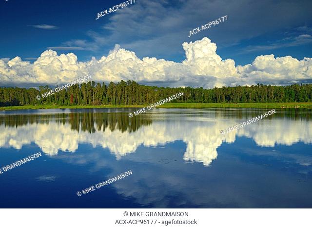 Clouds reflected in Isabel Lake Kenora Ontario Canada