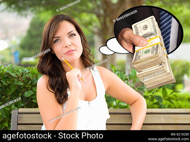Thoughtful young woman with hand holding stack of money inside thought bubble