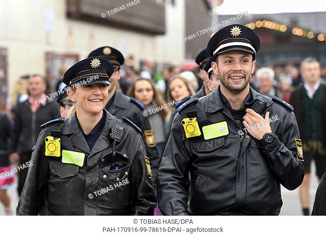 Police officers are equipped with bodycams on the opening day of the Oktoberfest funfair inÂ Munich, Germany, 16 September 2017
