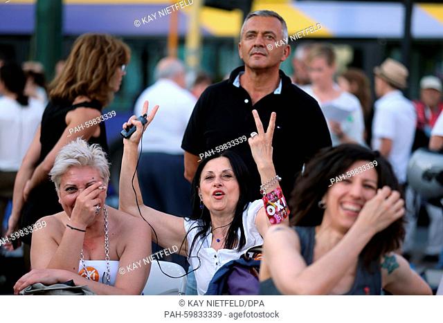 Supporters of the Syriza party and No vote campaign react after first results of the referendum at Klafthmonos square in central Athens, Greece, 05.07