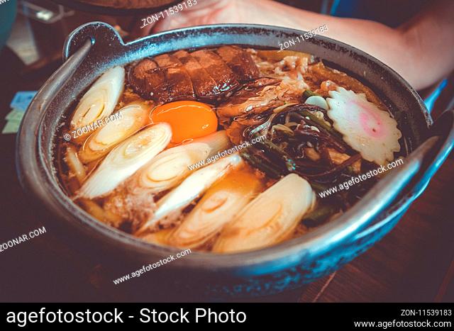 traditional japanese sukiyaki meal hot pot. Close-up view