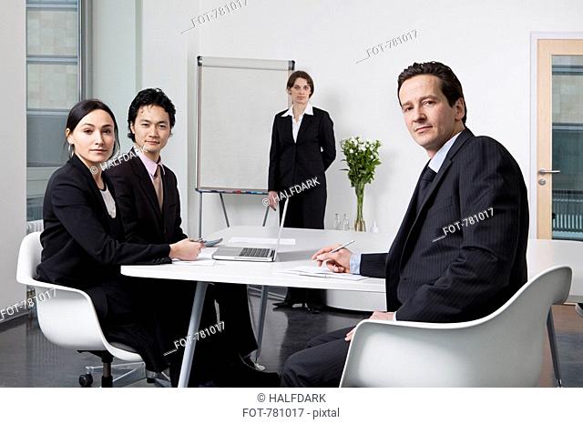 Portrait of four business people in a meeting