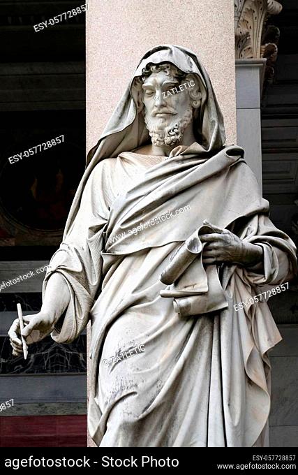 Saint Luke statue in front of the basilica of Saint Paul Outside the Walls, Rome, Italy