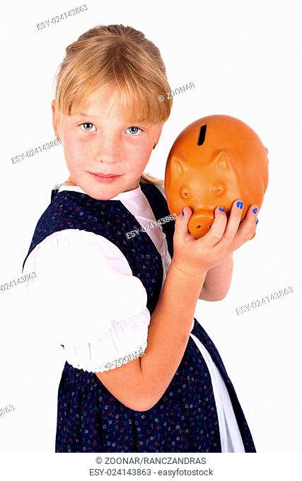 Cute little girl saving money in a piggy-bank