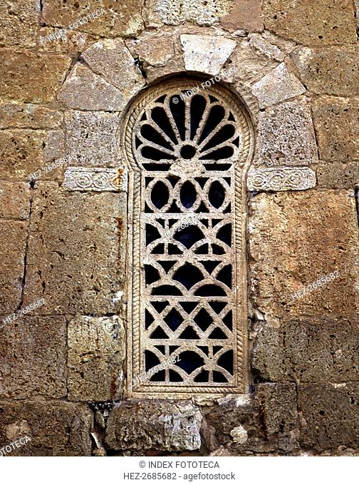 Window in the apse with a Visigothic lattice, in the church of San Juan de Baños