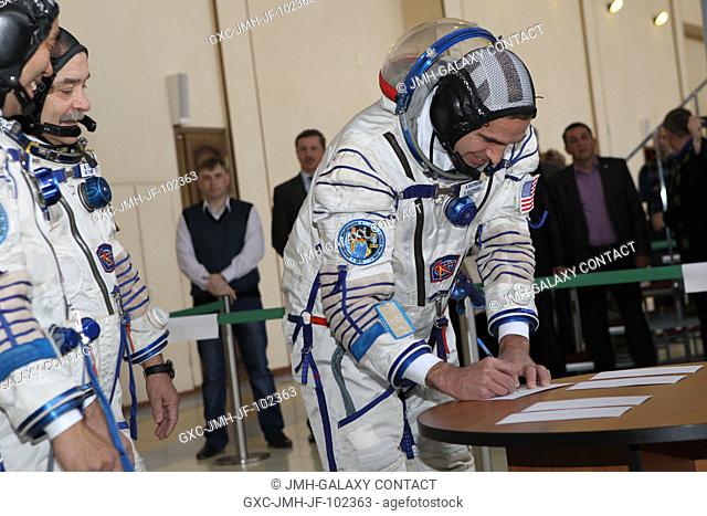 At the Gagarin Cosmonaut Training Center in Star City, Russia, backup Expedition 3637 crew member Rick Mastracchio of NASA signs in for qualification exams May...