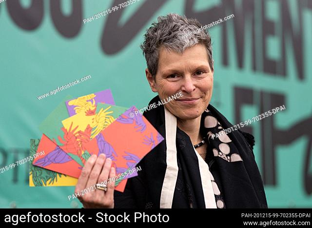 15 December 2020, Hessen, Kassel: Sabine Schormann, General Director of documenta und Museum Fridericianum gGmbH, smiles with greeting cards at the presentation...
